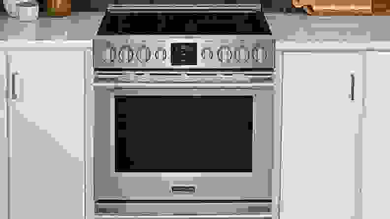 Frigidaire Professional PCFE3078AF electric range surrounded by white cabinets