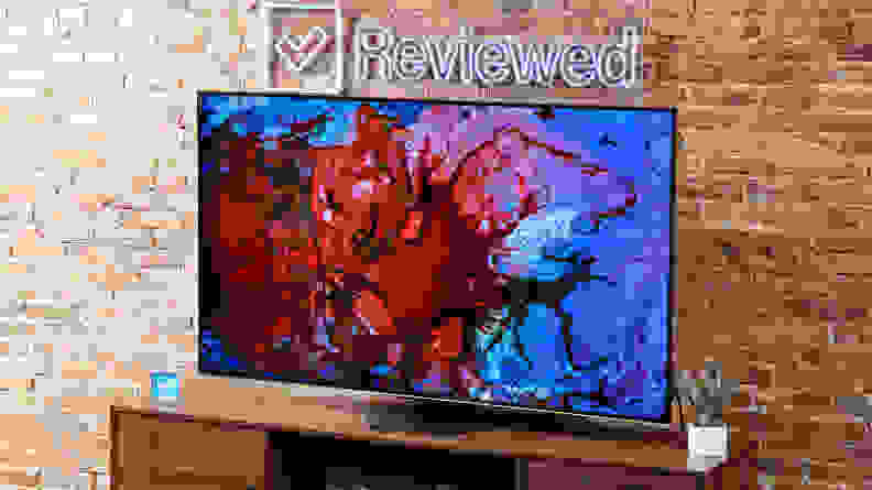 The tv displaying a splash of red and blue.