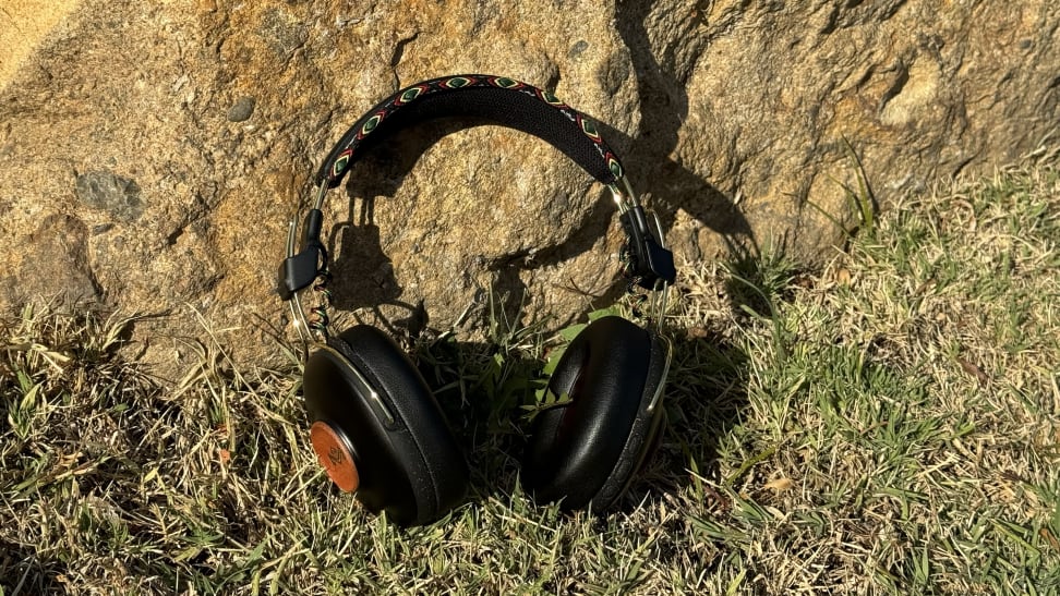 Marley Positive Vibration Frequency Headphones against a rock, outside.