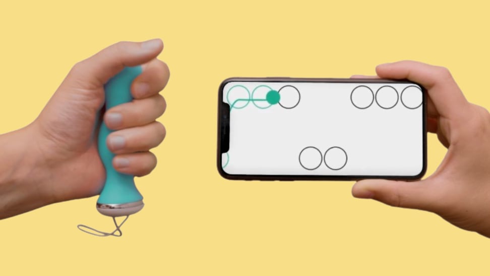 A hand holding the Perifit Care+ perineometer and another hand holding a cellphone with a game onscreen.