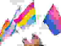 Two hands holding up mini Pride Flags (from right to left: bisexual flag, pansexual flag, transgender flag, and rainbow flag)