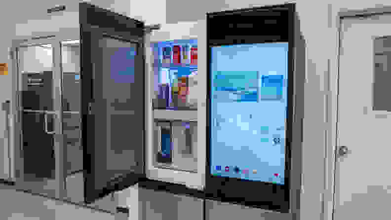 Samsung Bespoke Family Hub 4-door fridge with screeen on right and open door-in-door compartment on the left.