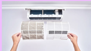 A person holding up two air conditioner filters. The left filter is dirty and the right is clean.