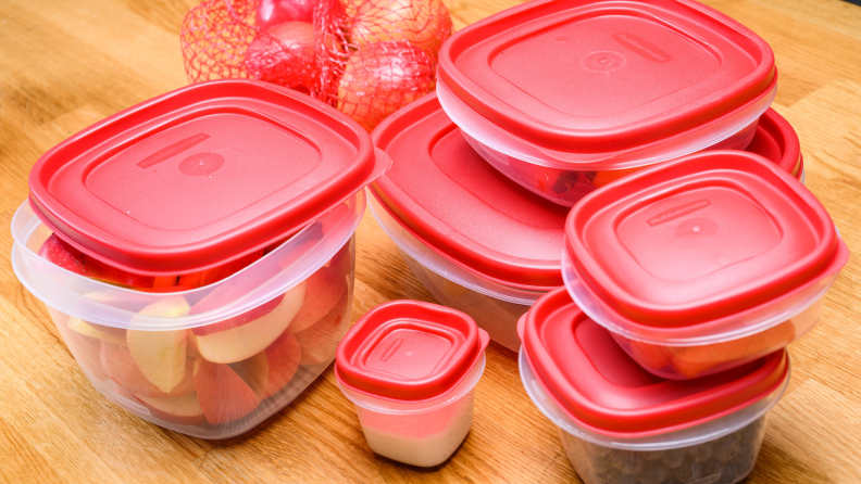 A set of Rubbermaid Easy Find Lids Food Storage Containers on a wooden surface.