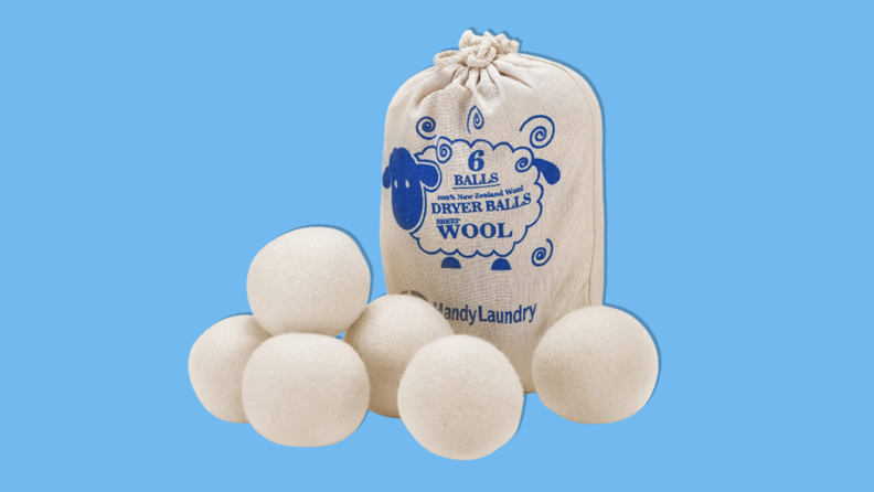 Wool dryer balls on a blue background.