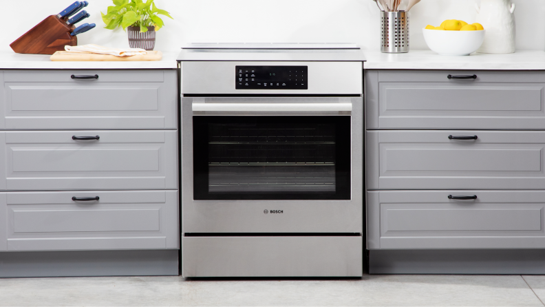 Bosch HII8057U 800 Series Induction Slide-in Range in modern kitchen setting.