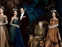 A still from the first series of The Crown featuring all the royals in gowns and suits.
