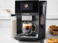 Bosch espresso machine on a kitchen counter with a prepared coffee mug inside.