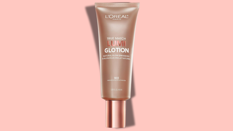 Bottle of L'Oréal Paris True Match Lumi Glotion on a pink background.