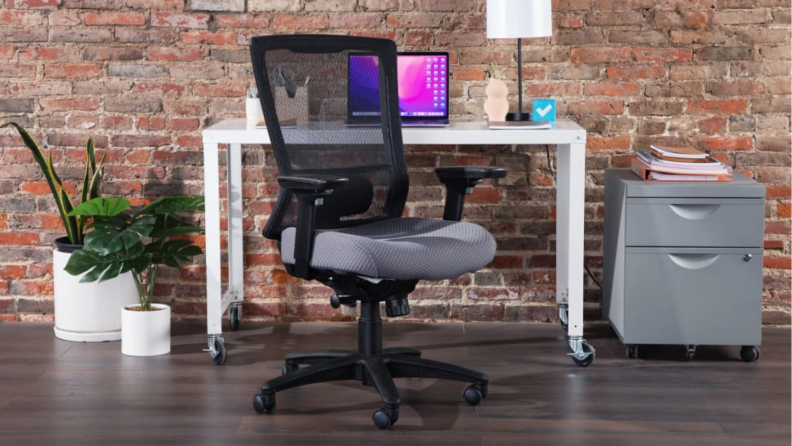 A Tempur-Pedic office chair at a desk.