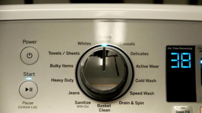 A close-up of a washing machine's cycle knob.